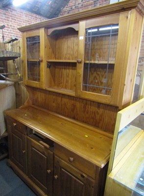 Lot 1060 - A late 20thC pine dresser, with two glazed...