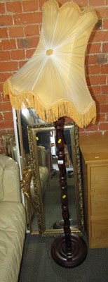 Lot 1014 - A standard lamp and mirrors, including three...