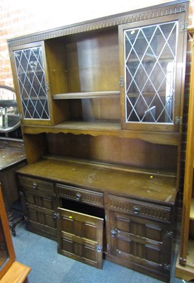 Lot 1024 - A dresser, finished in dark oak, with two...
