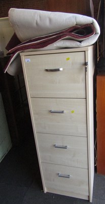 Lot 1038 - A wood finished four drawer filing cabinet,...