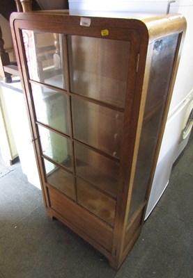 Lot 1061 - An oak display cabinet, eight glazed panels,...