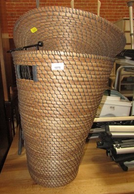 Lot 1075 - A wicker linen basket, together with a paper...
