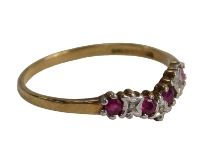 Lot 300 - A 9ct gold ruby and diamond wishbone ring, the...