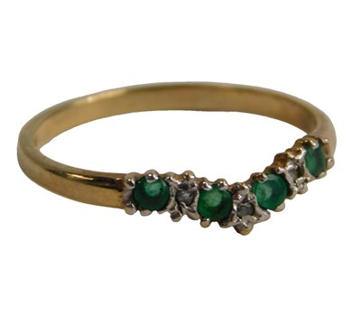 Lot 577 - A 9ct gold emerald and diamond wishbone ring,...