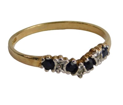Lot 582 - A 9ct gold diamond and sapphire wishbone...