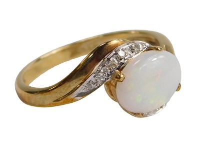 Lot 586 - A QVC 9ct gold opal and diamond ring, the...