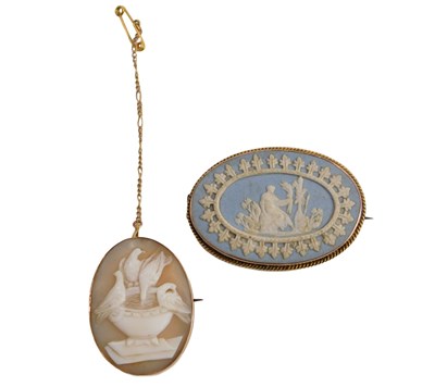 Lot 594 - A cameo brooch, depicting four birds feeding...