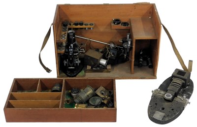 Lot 550 - A fitted hardwood box containing a microscope...