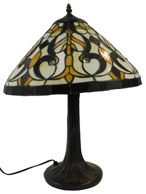 Lot 575 - A Tiffany style table lamp, the tapering shade...