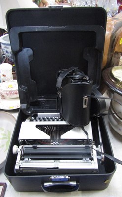 Lot 2028 - A cased portable vintage typewriter, a pair of...
