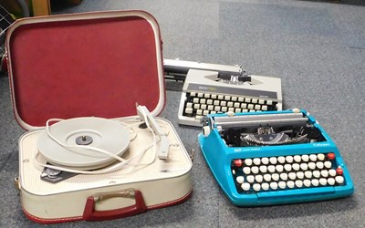 Lot 2052 - Two cased portable typewriters, and a cased...