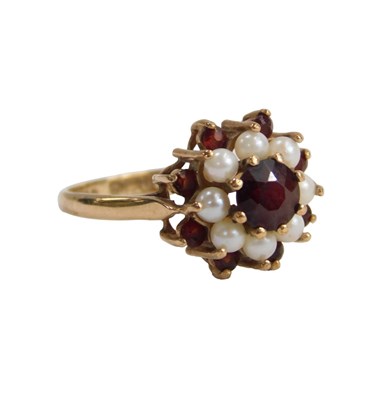 Lot 610 - A 9ct gold seed pearl and garnet floral...