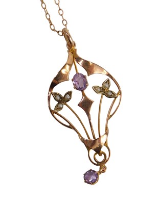 Lot 601 - An Art Nouveau style pendant, set with two...