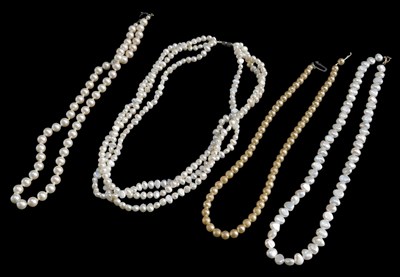 Lot 611 - A baroque pearl necklace, with yellow metal...