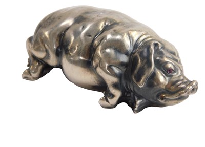 Lot 623 - A Russian white metal model of a recumbent pig,...