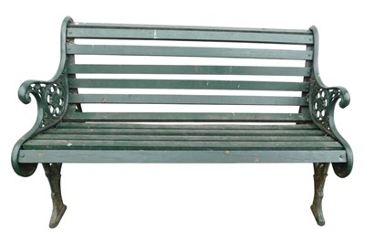 Lot 675 - A garden bench, with green painted cast iron...