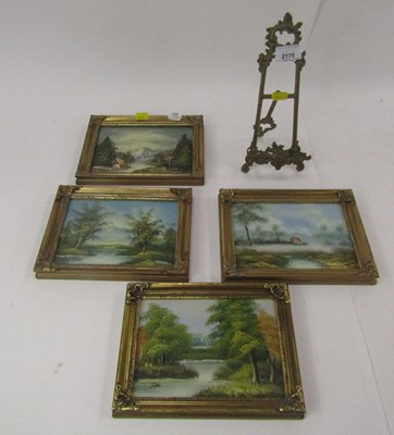 Lot 2175 - A small brass picture stand, and four gilt...