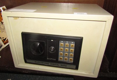 Lot 2184 - A small tabletop safe, with combination.