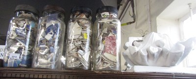 Lot 2212 - Four jars containing broken tiles and ceramics,...