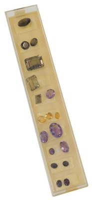 Lot 696 - A group of polished cut semi precious stones,...