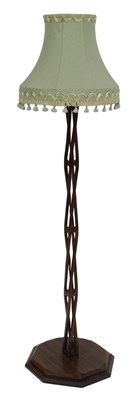Lot 717 - A 20thC mahogany standard lamp, the column of...