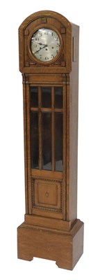 Lot 718 - A 20thC oak cased grandmother clock, the...