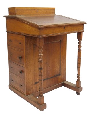 Lot 722 - A Victorian oak Davenport, the top with a...
