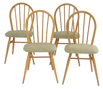 Lot 735 - A set of four Ercol light elm dining chairs,...