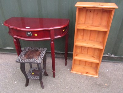 Lot 1094 - A pine bookcase, a small dark wood table, and...