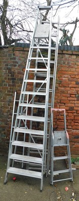 Lot 1123 - A set of loft ladders, an extending ladder,...