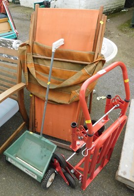 Lot 1136 - A vintage deckchair, a lawn spreader, sack...