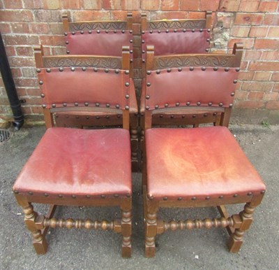 Lot 1108 - A set of four carved oak dining chairs, raised...