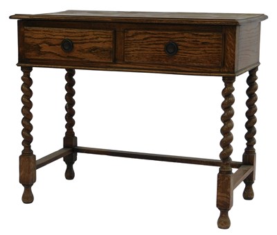 Lot 767 - A 20thC oak side table, the top with a moulded...