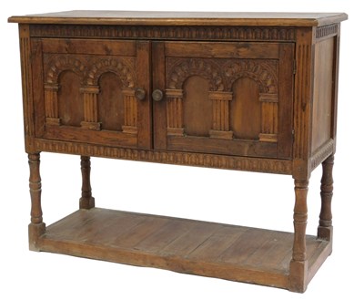 Lot 768 - A 20thC oak side cabinet, the top with a...