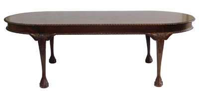 Lot 771 - A 20thC mahogany dining table, the oval top...