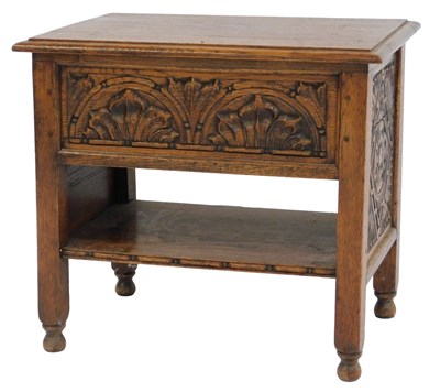 Lot 779 - A 20thC oak sewing table, the hinged lid...