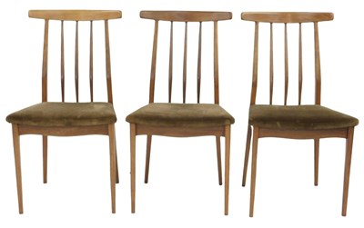 Lot 793 - A set of three 1970s teak dining chairs, each...