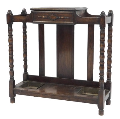 Lot 797 - A 20thC oak umbrella stand, the top with a...