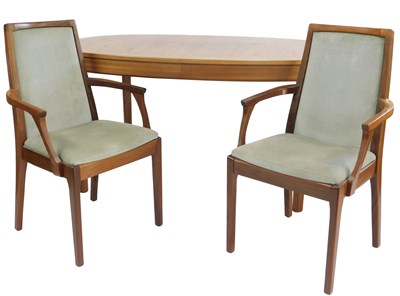 Lot 832 - A teak extending dining table, the oval top...