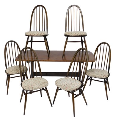 Lot 816 - An Ercol dark elm trestle table, 70cm high,...