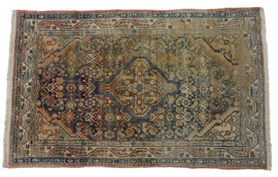 Lot 819 - A Persian blue ground rug, with central...
