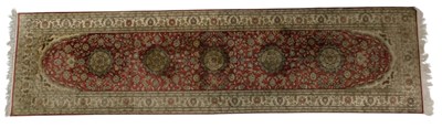 Lot 821 - A Persian red ground rug, with central lozenge...
