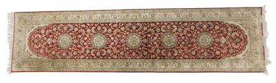 Lot 822 - A Persian red ground rug, with central lozenge...