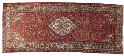 Lot 825 - A Persian Tabriz red ground rug, decorated...