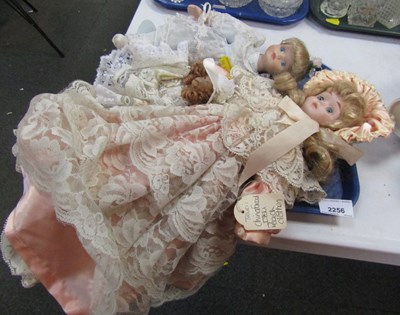 Lot 2256 - Three dolls, dressed, small, medium and large....