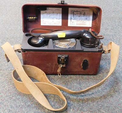 Lot 2274 - A vintage field telephone, in case.