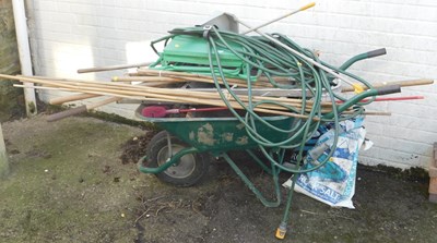 Lot 1140 - A metal wheelbarrow, with a step ladder, canes,...