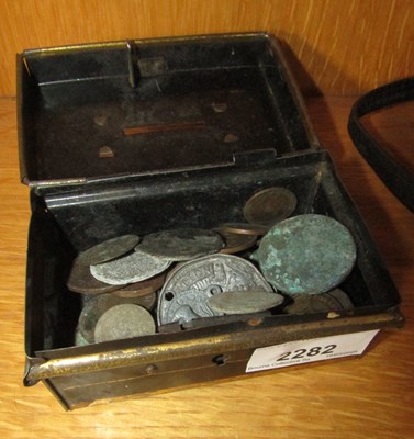 Lot 2282 - A small cash tin, metal, containing a quantity...