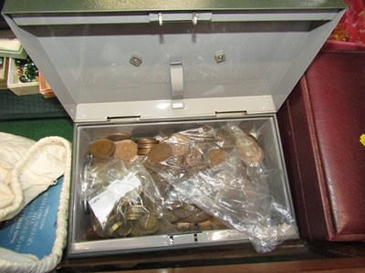 Lot 2303 - A cash tin, complete with contents of mostly...
