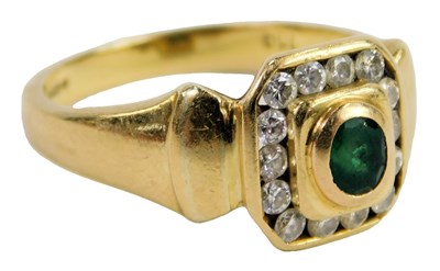 Lot 304 - An 18ct gold emerald and diamond ring, the...